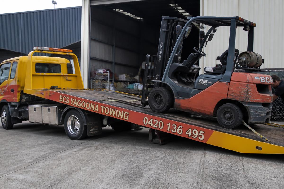 Forklift loaded onto a BCS Yagoona Towing flatbed tow truck